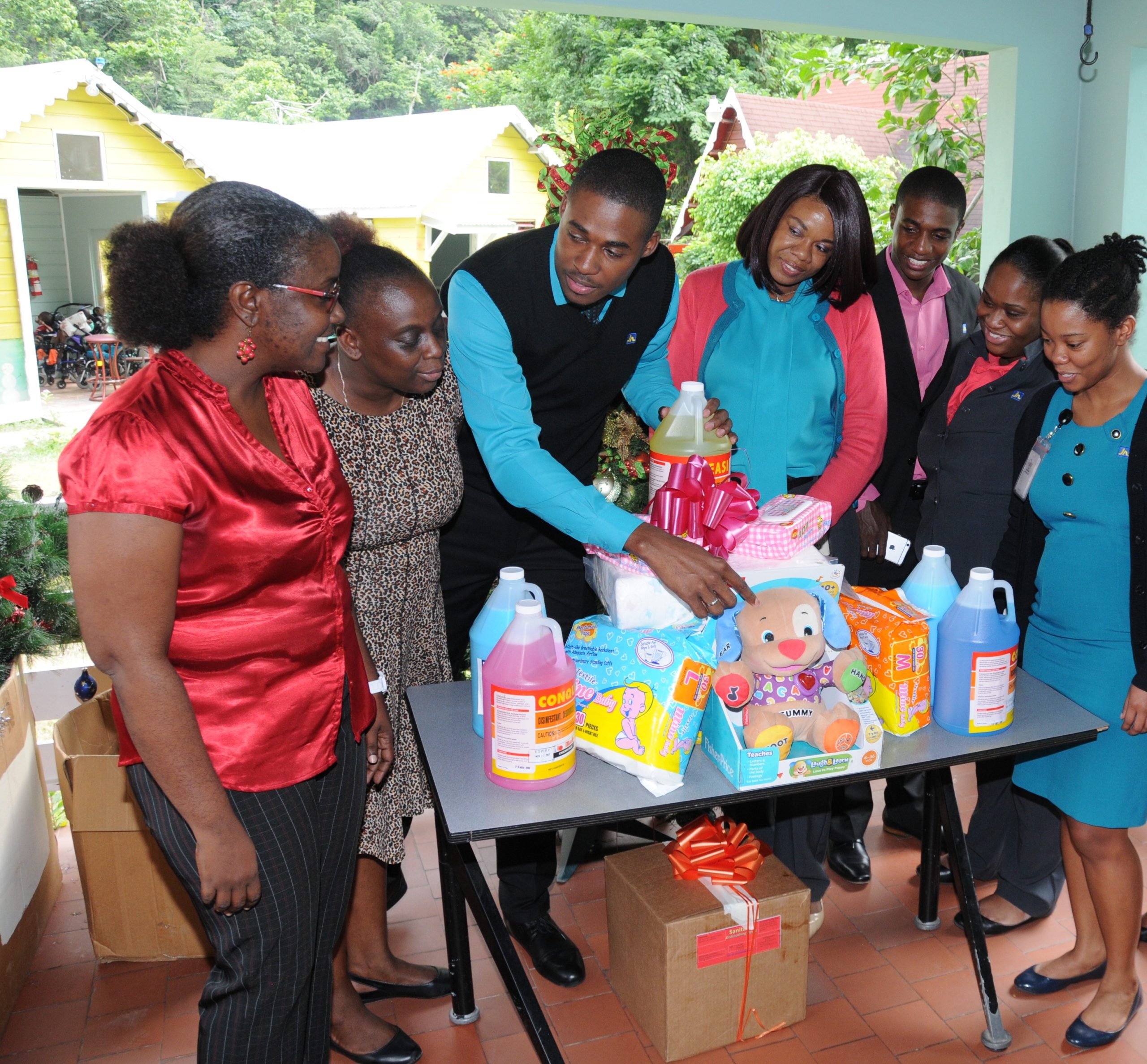 Opal Bailey (left), Childcare Manager of Sophie’s Place and Christine Watson (second left), Matron, Sophie’s Place; are delighted to receive donation of supplies from employees of The Jamaica National Group, who have for the past 10 years have been helping to sponsor the cost of medication for the children of the home every month.